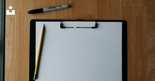 Clipboard with pen used to fill out California small claims SC-100 filing form