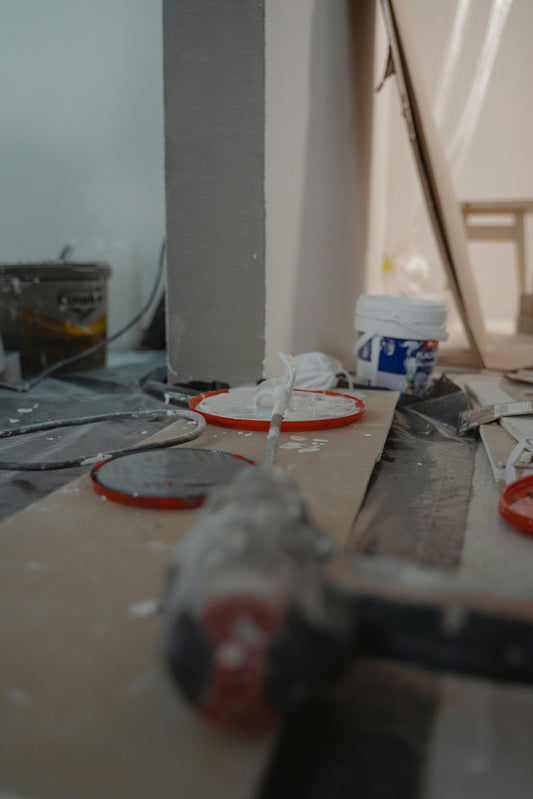 Unfinished construction site with rough plumbing on a concrete floor, illustrating contractor disputes that lead to small